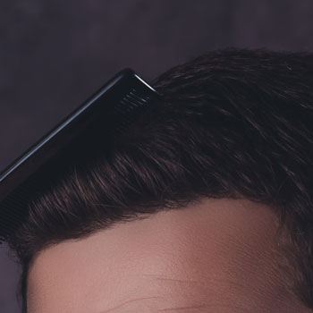 A Man In Suit Combing Hair July 2017