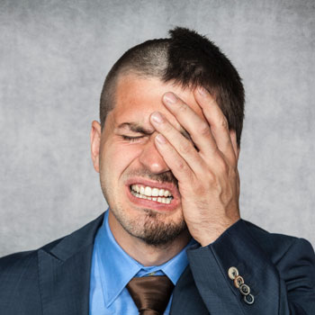 A Man In Suit With Bad Haircut July 2017