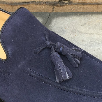 Closeup Of Tassels On Blue Loafer