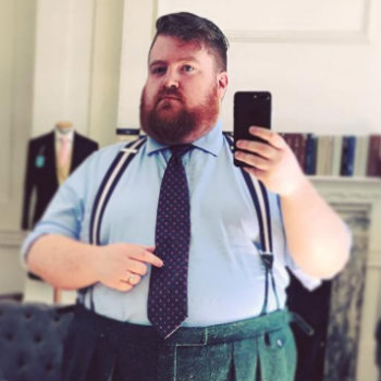 Man In Blue Tie And Green Pants