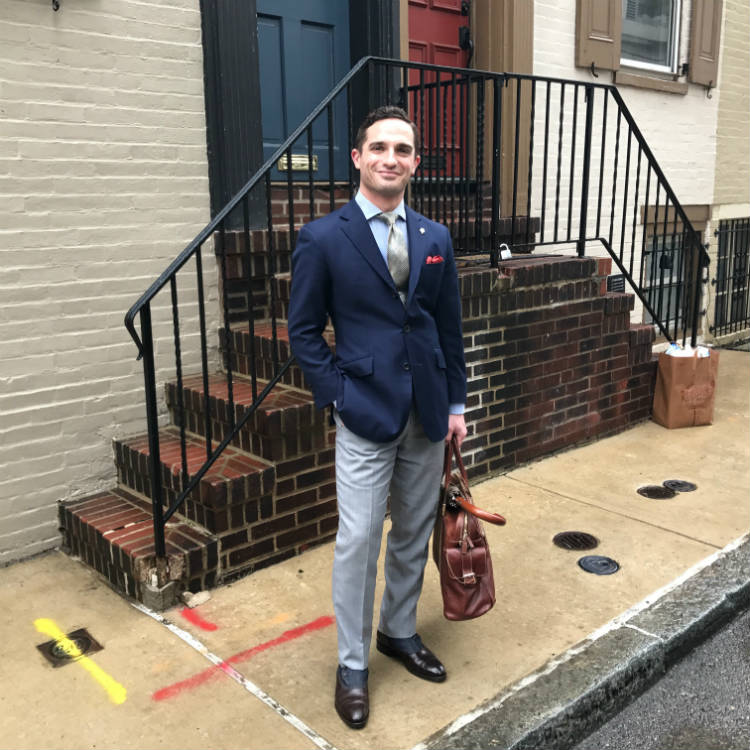 Short Man In Blue Jacket And Grey Pants