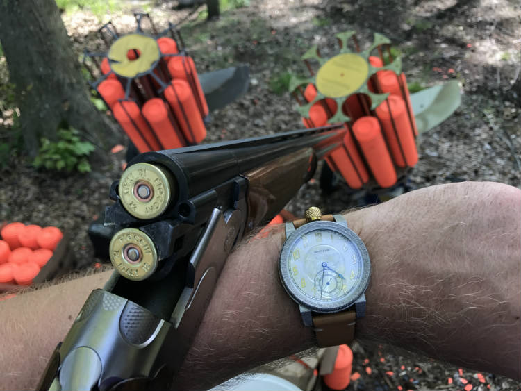 Vortic watch and shotgun with shells in Vortic watch and shotgun with shells in