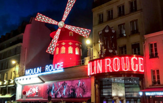 bespoke unit moulin rouge exterior at night