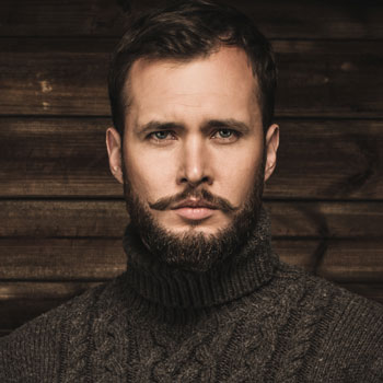 A Man Wearing Cardigan Verdi Beard July 2017