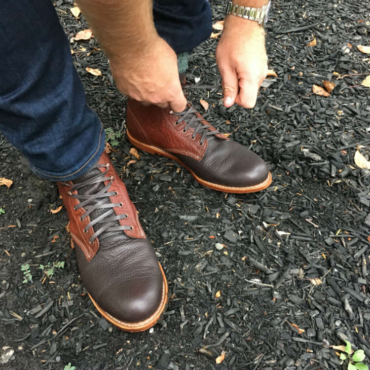 Boots Being Tied By Man WIth Watch