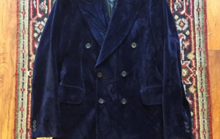 Blue velvet blazer on carpet