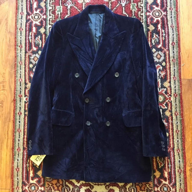 Blue velvet blazer on carpet