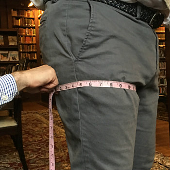 Man getting thigh measured