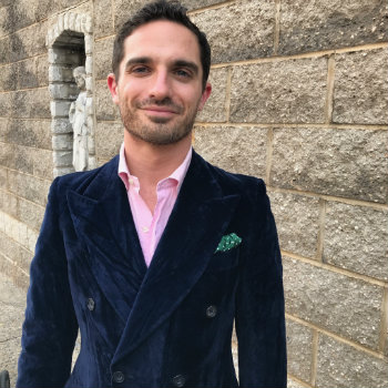 Man in blue blazer with green hankie