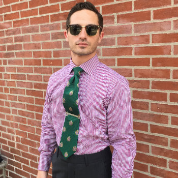 Man in sunglasses and purple shirt