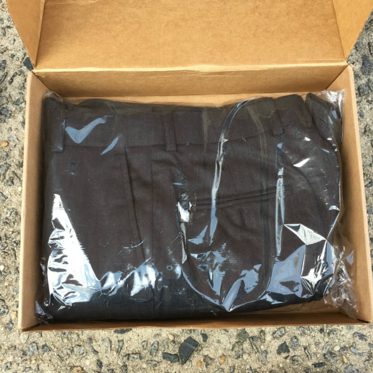 Suit folded in shipping box