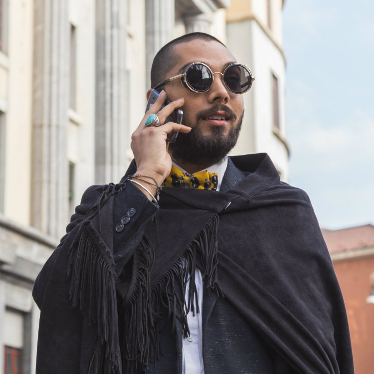 eccentric man in round glasses frames
