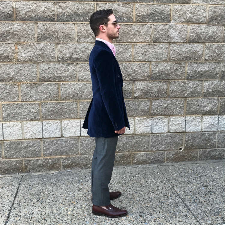side of man in blue vintage blazer