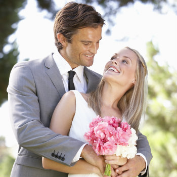 Couple-Holding-Each-Other-At-Wedding