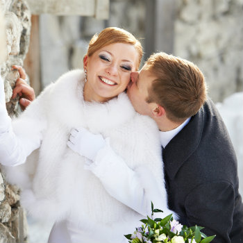 Couple-Kissing-At-Wedding