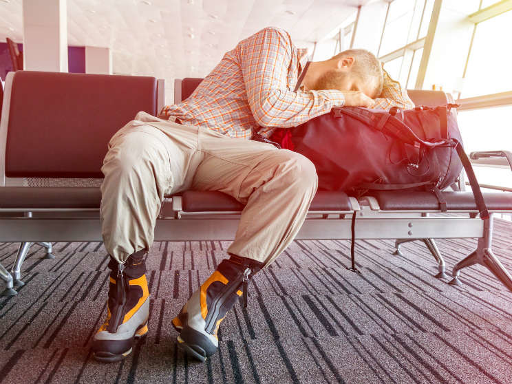 Man Sleeping At Airport