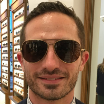 Man in aviator sunglasses and tie