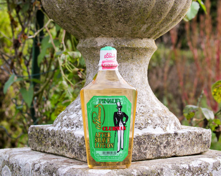 Pinaud Clubman After Shave Lotion Bottle In Front Of Statue