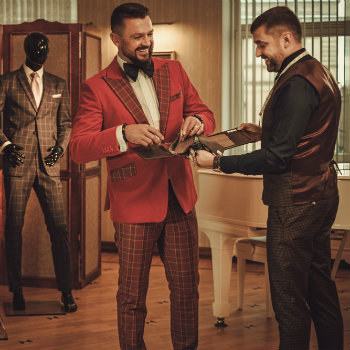 Tailor-And-Client-Looking-At-Fabrics