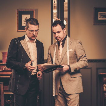 Tailor And Customer Selecting Cloth