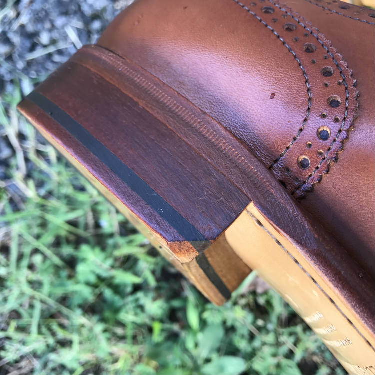 gentlemans cut on brown shoe