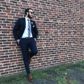 guy in blue suit and brown shoes