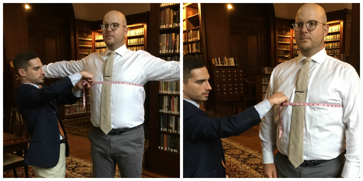 man getting chest size measured