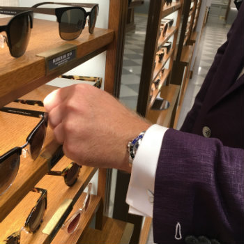 man's hand selecting glasses