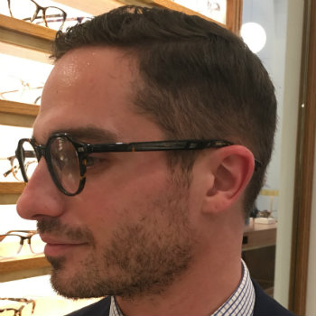 side view of man wearing glasses