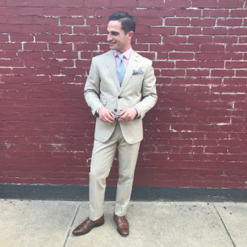 small man in khaki suit