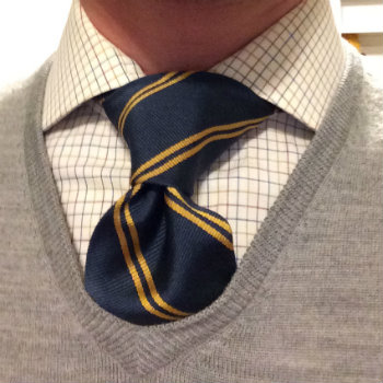 striped tie against check shirt