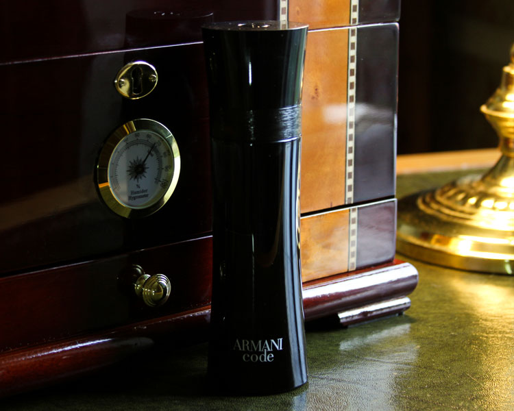 Armani Code Bottle On Old Desk With Humidor Armani Code Bottle On Old Desk With Humidor
