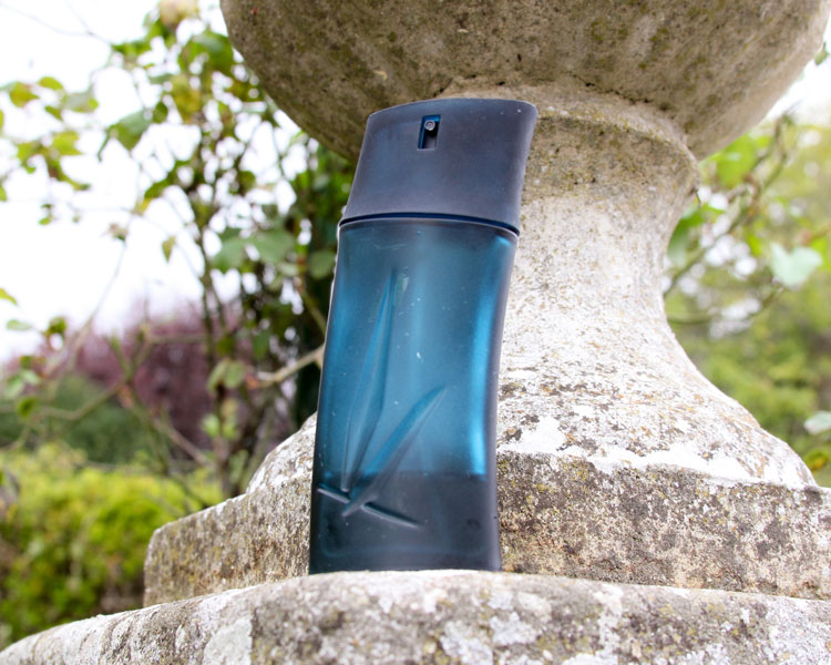 Kenzo Homme Bottle In Fron Of A Stone Vase