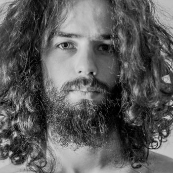 Man With Curly Hair & Beard