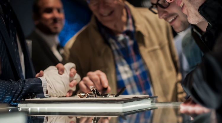 Several men looking at Zenith Watch