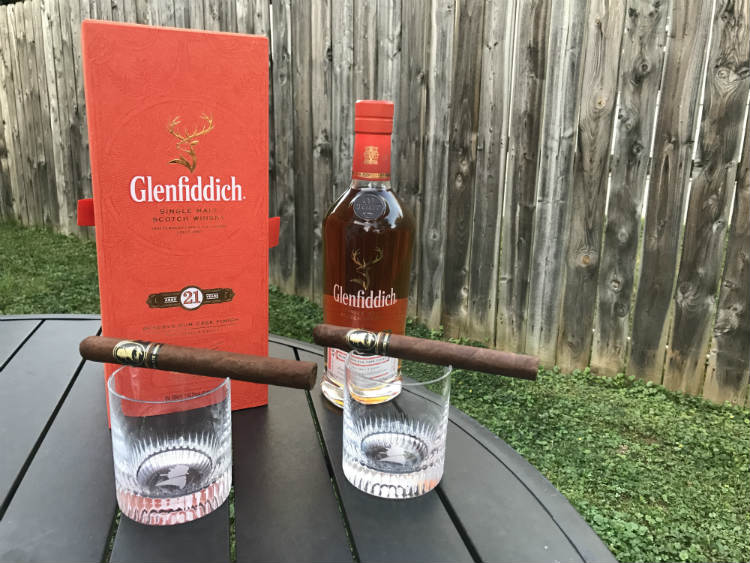 Whisky bottle alongside Davidoff glasses
