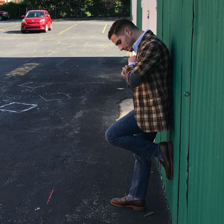 man in plaid jacket and jeans