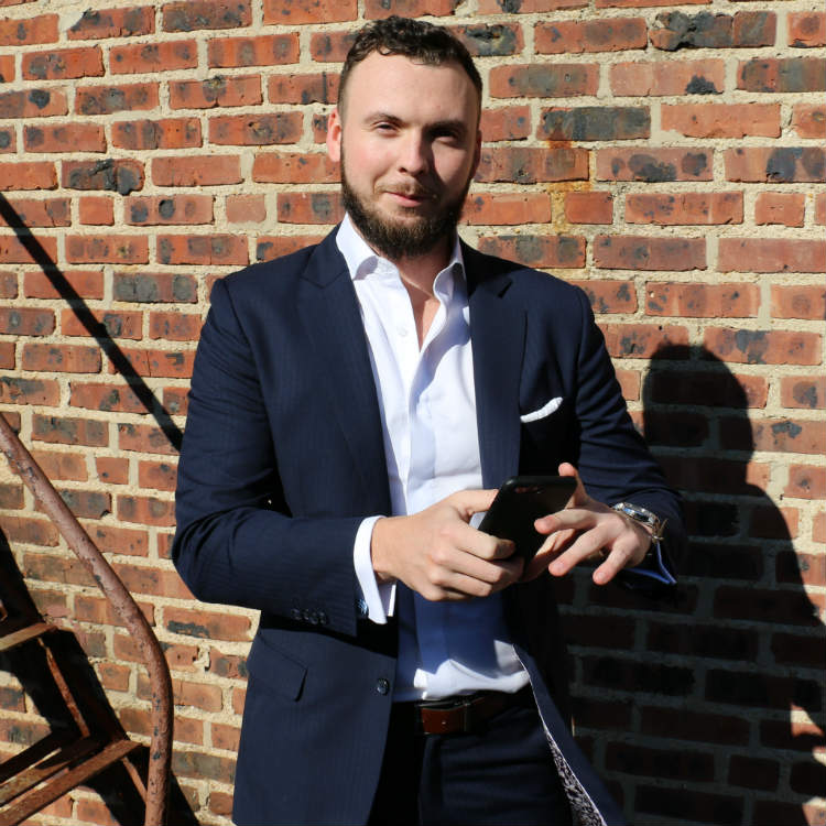 Man in blue suit with no tie