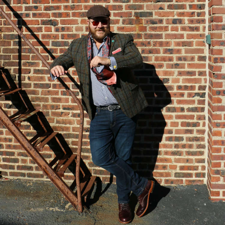 Paul Anthony in plaid sport coat