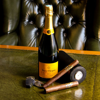 Veuve Clicquot Carte Jaune Champagne & Davidoff Cigars On A Leather Desk