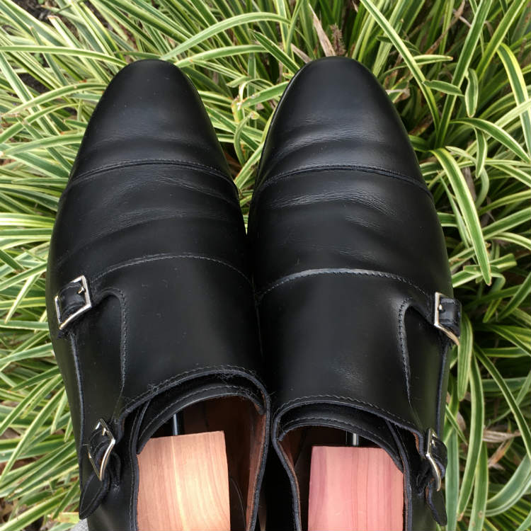 black monkstrap shoes with shoe trees