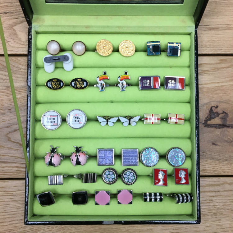 jewelry case filled with cufflinks