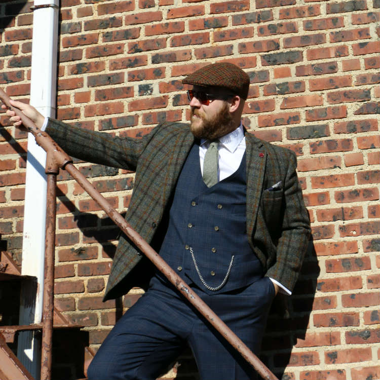 man in odd jacket and trousers