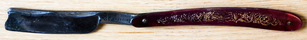 open-antique-straight-razor-with-barber-notch open-antique-straight-razor-with-barber-notch