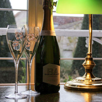 Bottle of Baron Albert Symbolique Brut Nature Champagne with flutes