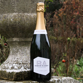 Bottle of Baron Albert Symbolique Brut Nature On Stone Wall
