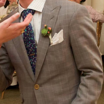 boutonniere in wedding suit jacket