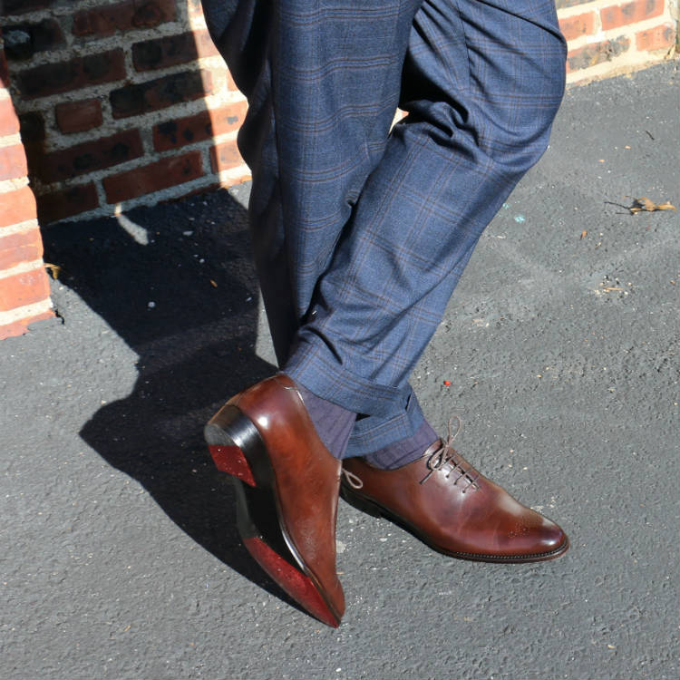 brown wholecuts with blue trousers