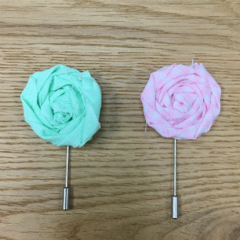 green and pink lapel flowers