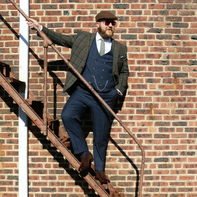 man in vest and coat with wholecuts